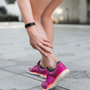 Runner experiencing sports injury in the back of their leg