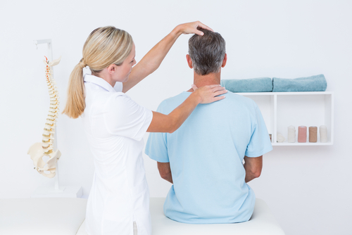Osteopath treating back pain