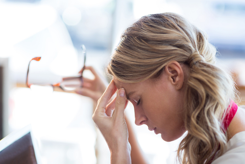 Young woman experiencing tension headache