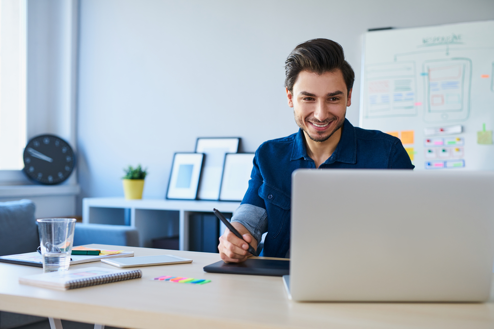 Happy Man Working On Laptop